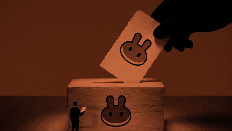 A giant hand drops an oversized CAKE-marked slip into a ballot box bearing the PancakeSwap logo while a tiny suited figure holds a small slip beside it.