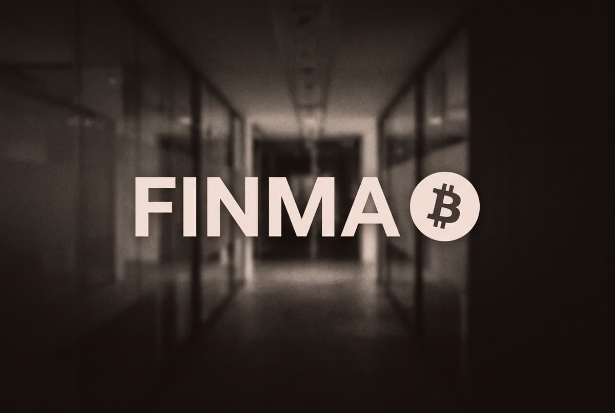 The name FINMA in large pale letters beside a Bitcoin coin, in front of a blurred glass corridor.