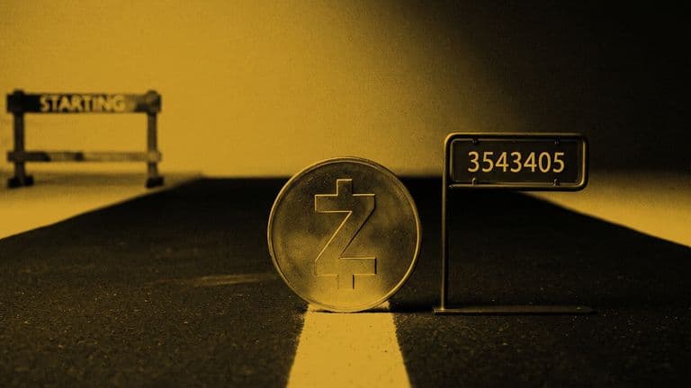 A Zcash coin stands upright on a painted starting line on a dark road, beside a small sign with the number 3543405, with an unfinished starting gate behind it.