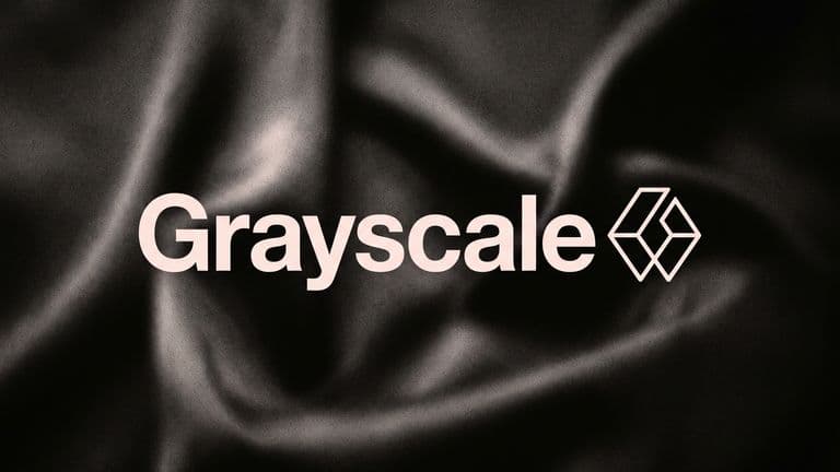 The name Grayscale in large pale letters beside its logo, centred over soft dark folds of silk.