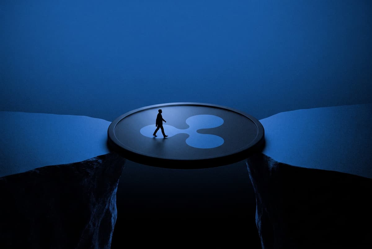 A small suited figure walks across a giant coin with the RLUSD mark that is laid like a bridge over a dark chasm between two cliffs.