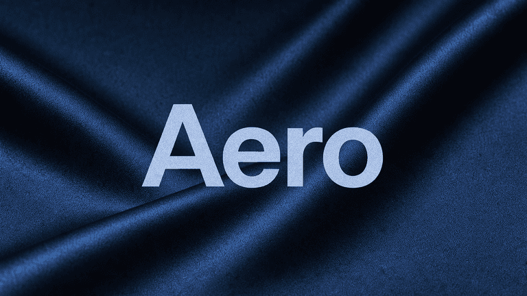 The word Aero in large pale letters centred over two dark, blurred folds of silk that flow in from opposite sides and merge into one.