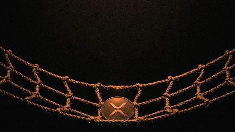 A coin with the XRP mark lies in the sagging centre of a rope safety net stretched over a dark drop.